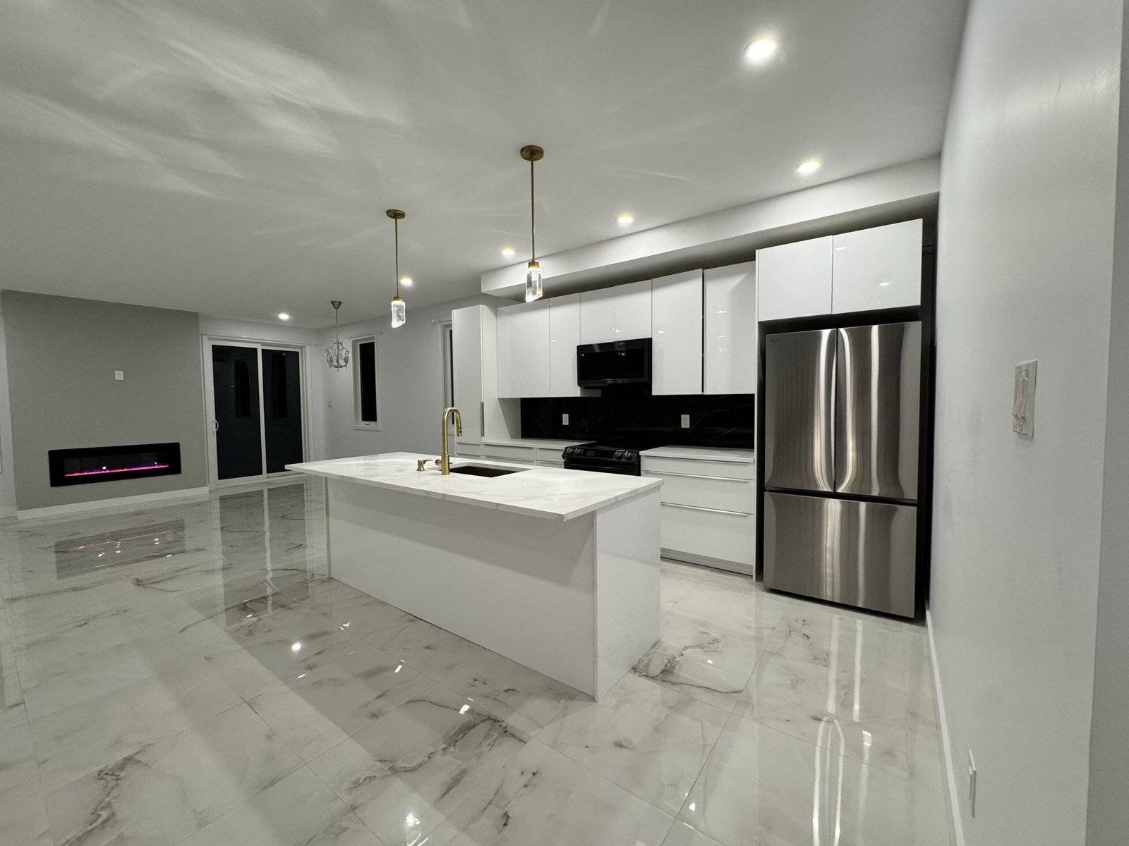 Kitchen renovation with custom cabinets, countertops, and modern design